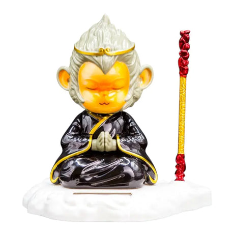 Mediternande apafigur med stav